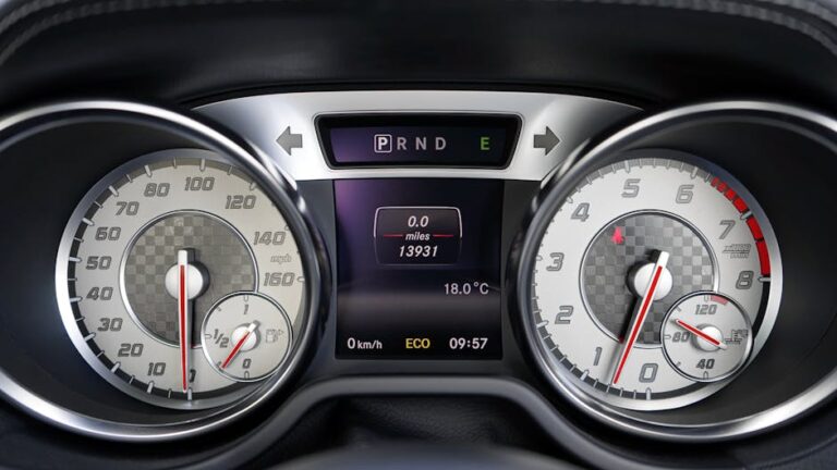 Detailed view of a vehicle dashboard showing speedometer, odometer, and temperature gauge.